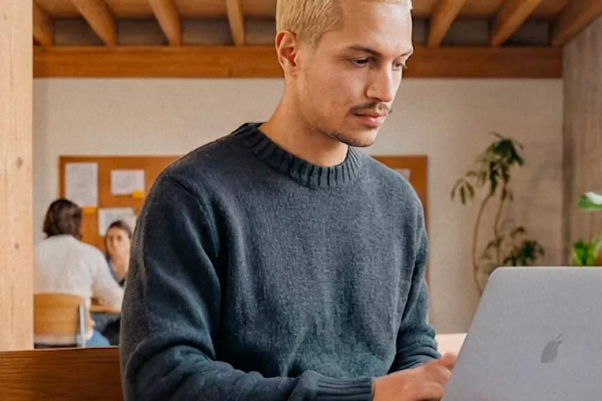 A Deel customer working on a laptop
